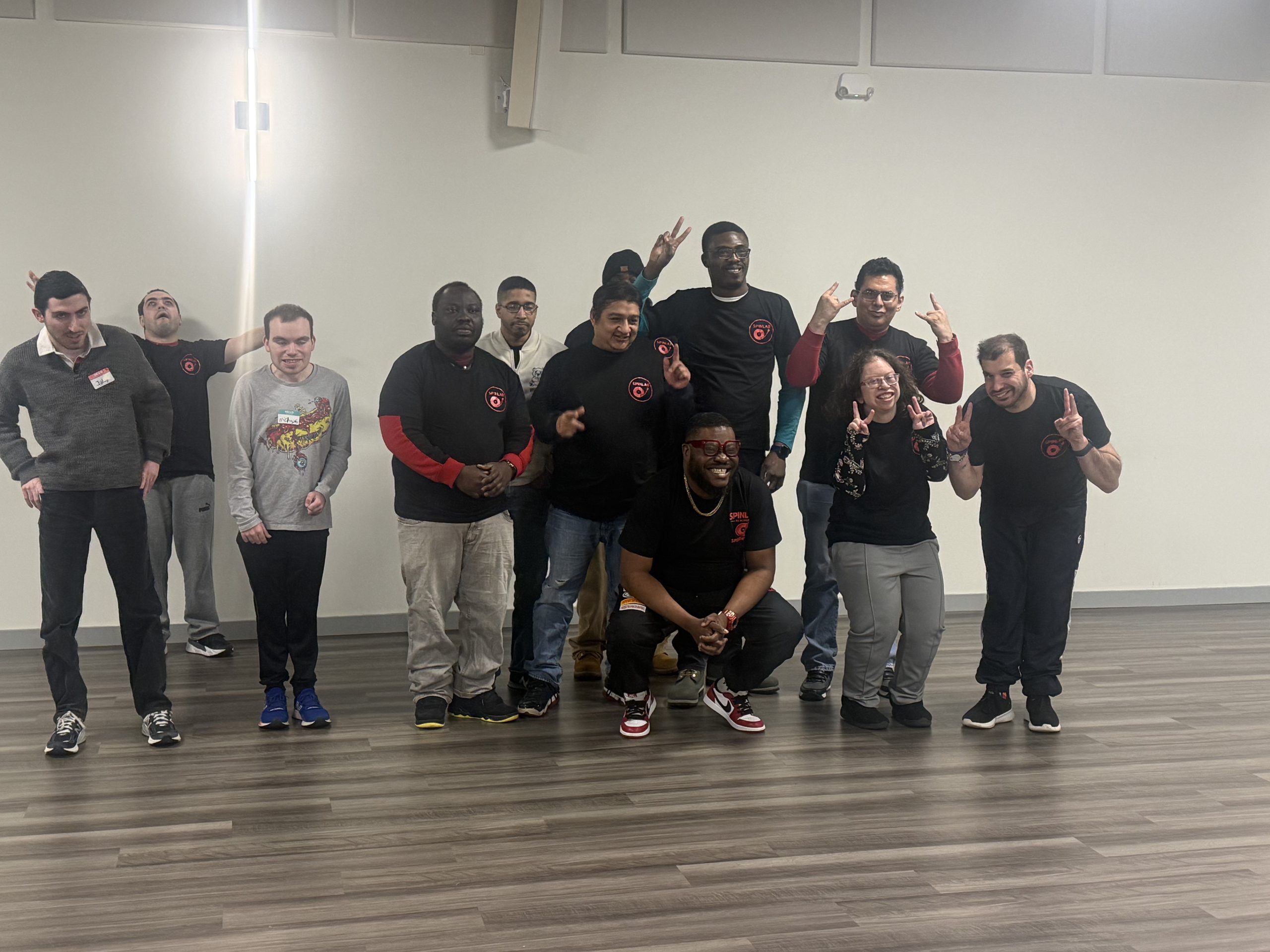 SpinLab students and instructors celebrating a group DJ class