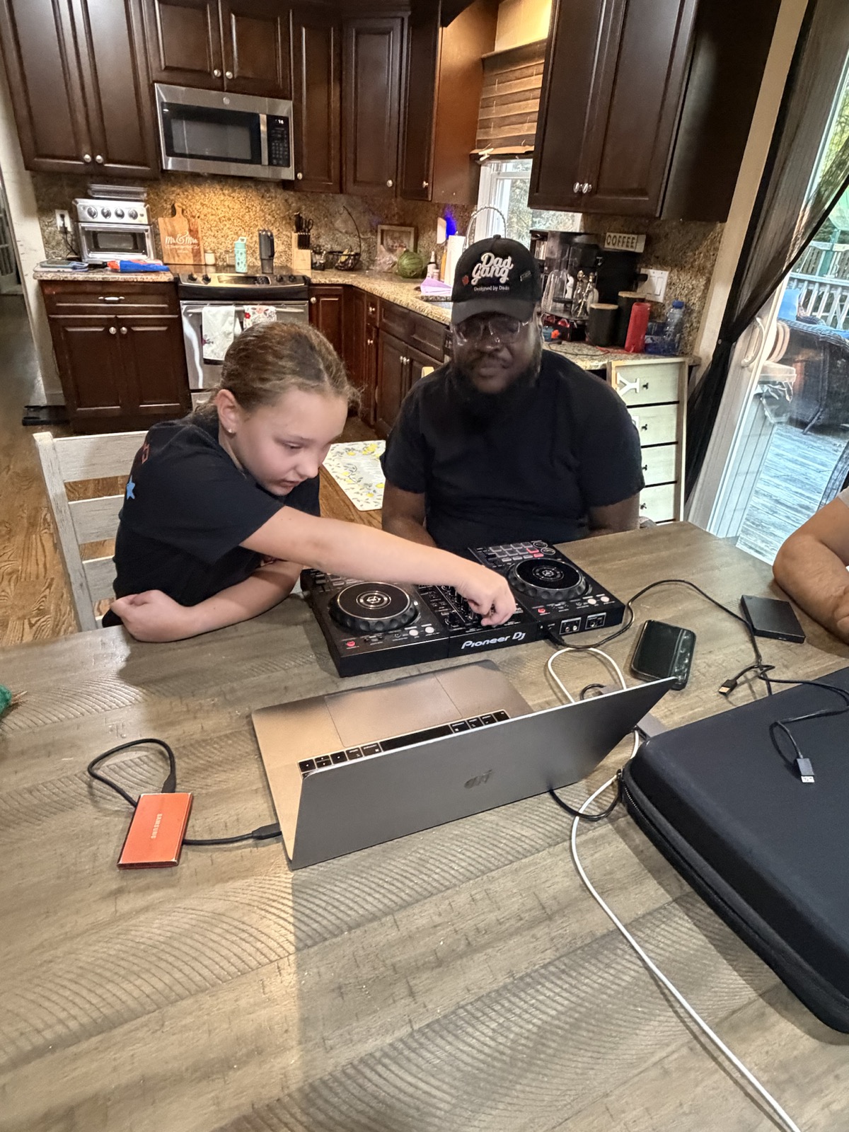 Student practicing controller skills with DJ Mackie