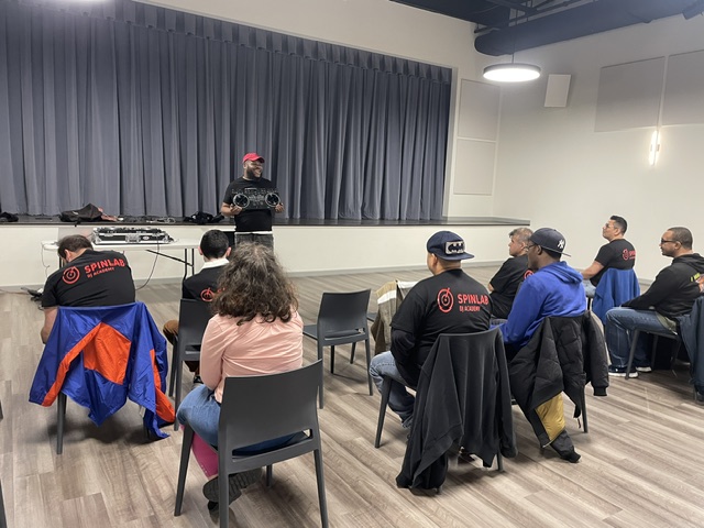 SpinLab Studios student learning DJ skills